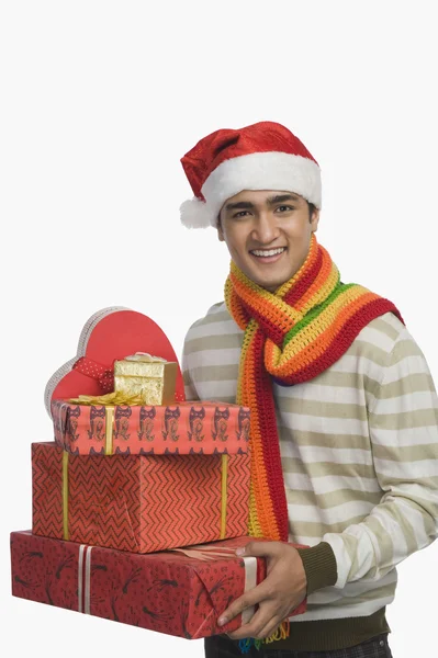 Man holding Christmas presents — Stock Photo, Image