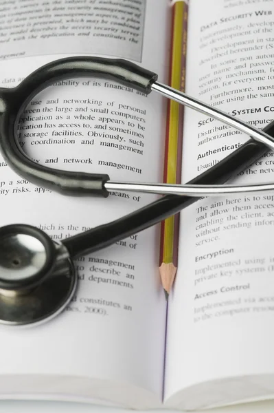 Stethoscope on an open book — Stock Photo, Image