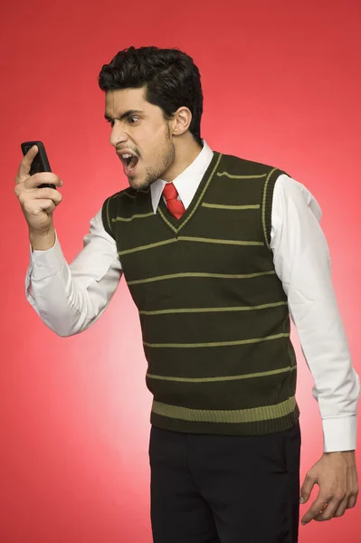 Businessman shouting on a mobile phone — Stock Photo, Image