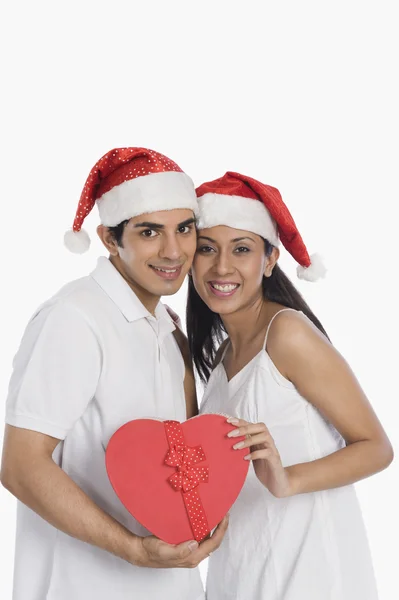 Man giving a Christmas present to his girlfriend — Stock Photo, Image