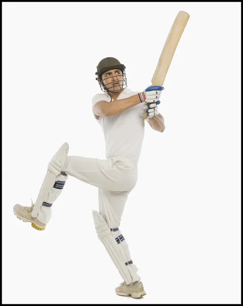 Cricket batsman spelen een hook shot — Stockfoto