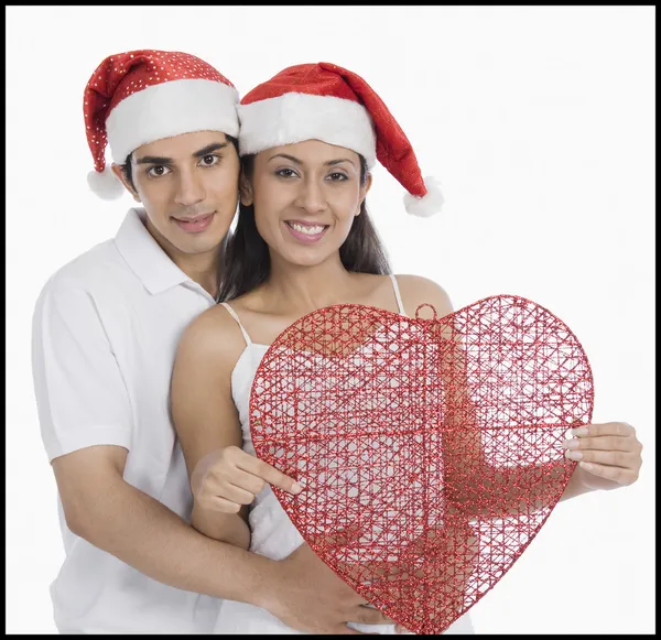 Casal usando chapéus de Santa — Fotografia de Stock