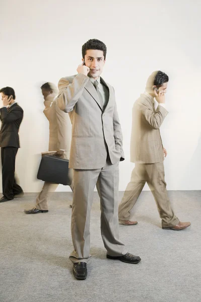 Businessman talking on a mobile phone — Stock Photo, Image