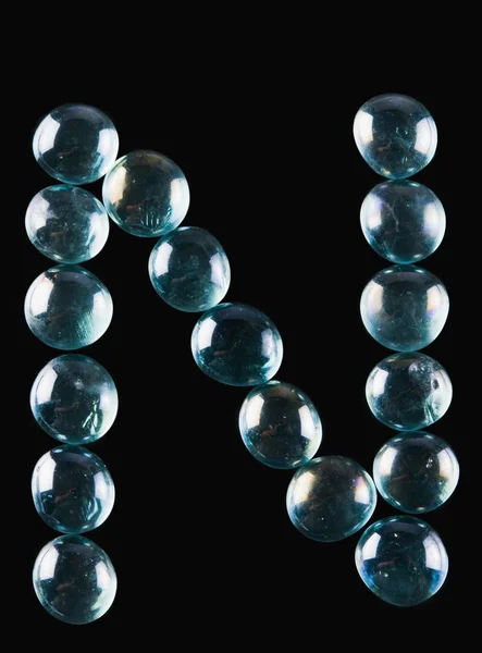 Bolas de mármol en forma de letra N — Foto de Stock