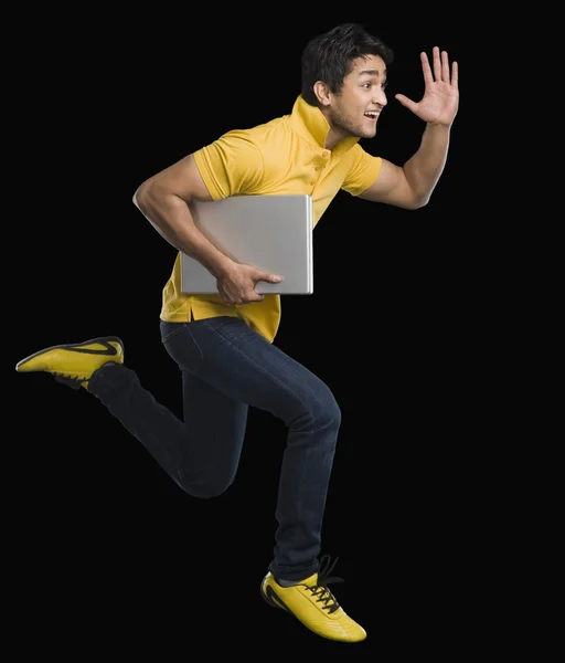 Man carrying a laptop — Stock Photo, Image