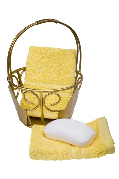 Bar of soap with towels and a basket — Stock Photo, Image