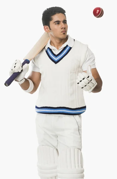 Cricket batsman holding a bat — Stock Photo, Image