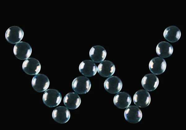 Marmor bollar i form av bokstaven w — Stockfoto