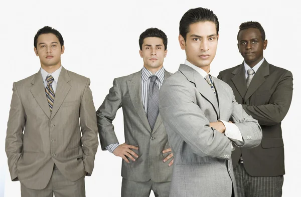 Four businessmen standing together — Stock Photo, Image