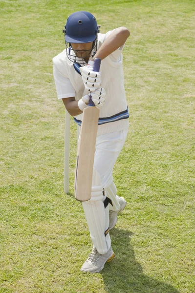 Batsman in backward defense stance — Stock Photo, Image