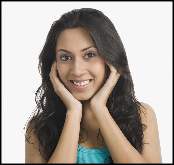 Woman with hands on chin — Stock Photo, Image