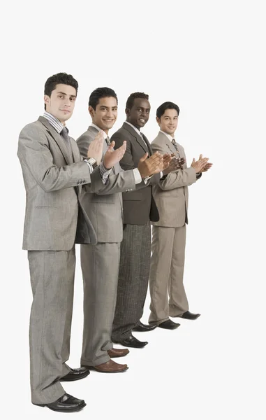 Négy üzletemberek tapsolt — Stock Fotó