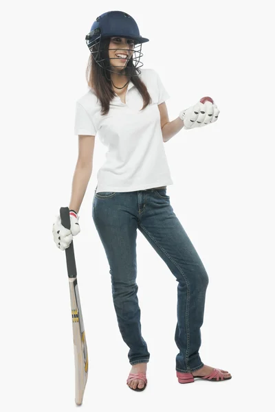 Female cricket fan holding bat and a ball — Stock Photo, Image