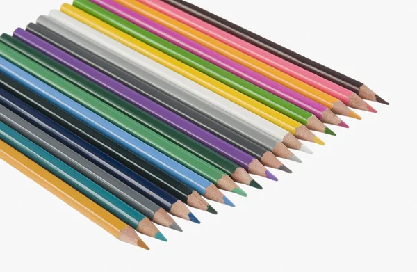 Colored pencils in a row — Stock Photo, Image