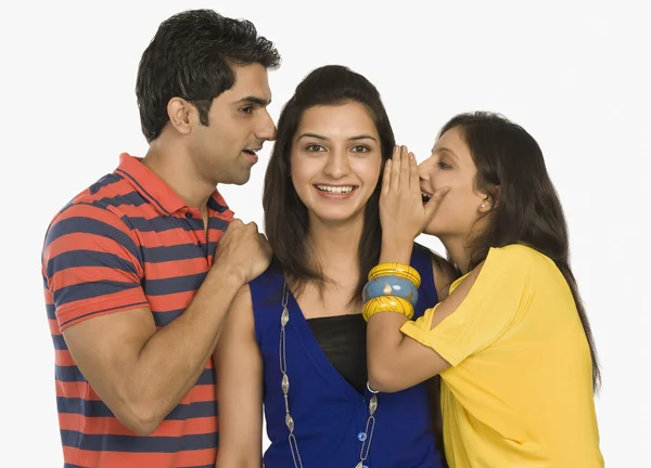 Woman whispering to her friend — Stock Photo, Image