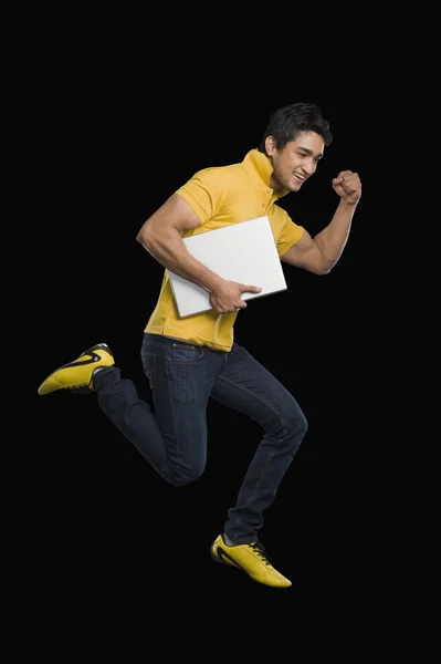 Man carrying a laptop — Stock Photo, Image