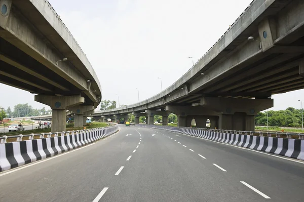 Road in the middle of overpasses — Stock Photo, Image