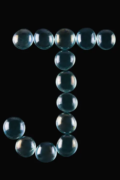 Bolas de mármore em forma de letra J — Fotografia de Stock