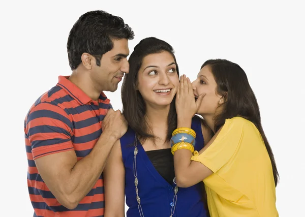 Woman whispering to her friend — Stock Photo, Image