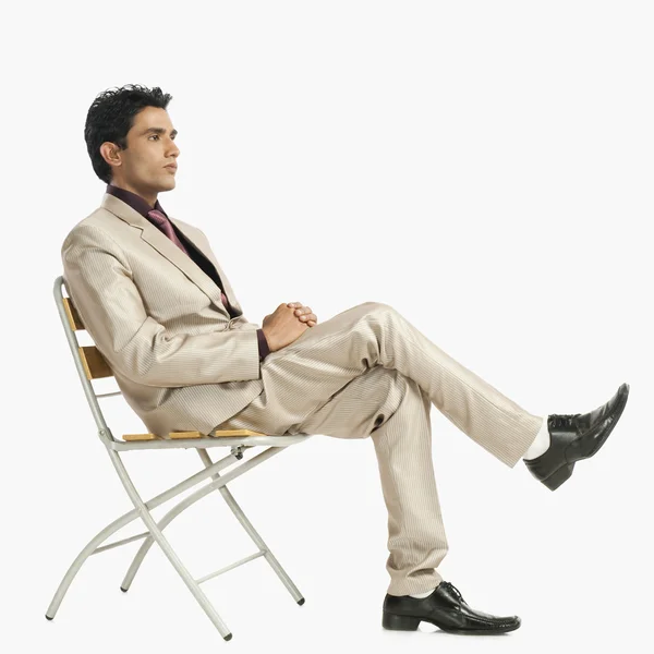 Businessman sitting on a chair — Stock Photo, Image