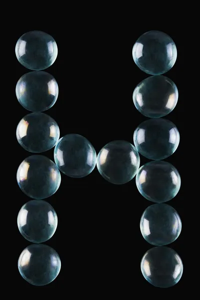 Bolas de mármol en forma de letra H — Foto de Stock