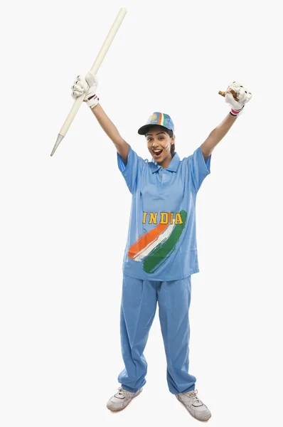 Female cricketer holding a cricket stump — Stock Photo, Image