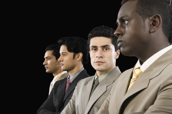 Businessman standing with his colleagues — Stock Photo, Image