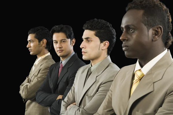 Businessman standing with his colleagues — Stock Photo, Image