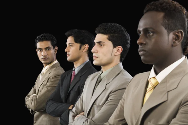 Businessman standing with his colleagues — Stock Photo, Image