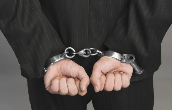Businessman tied up with handcuffs Royalty Free Stock Images