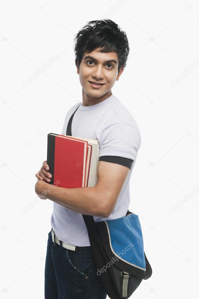 College student holding notebooks
