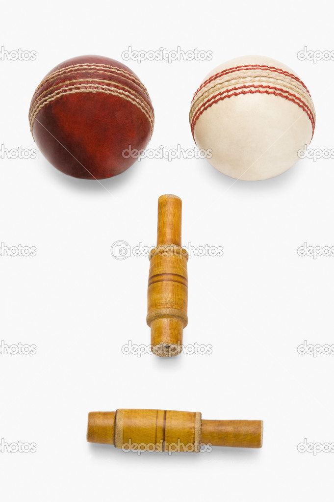Cricket balls and bails forming a human face