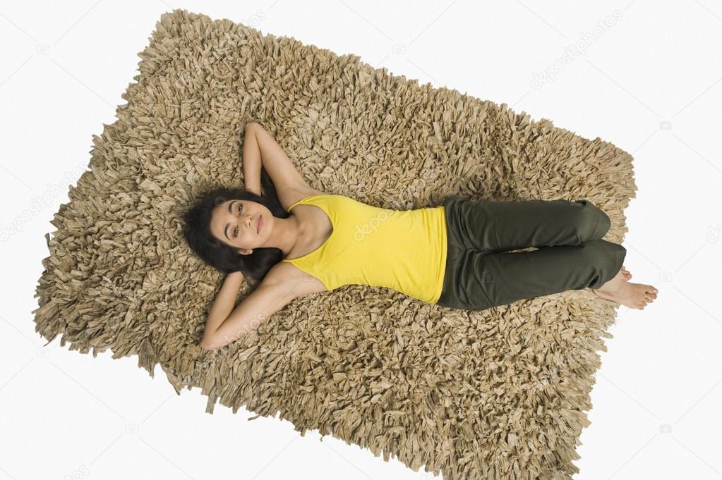 Woman lying on a rug