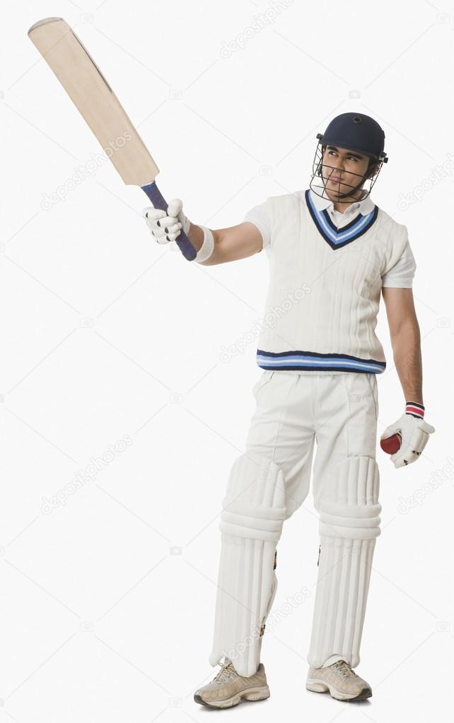 Cricket player showing his bat