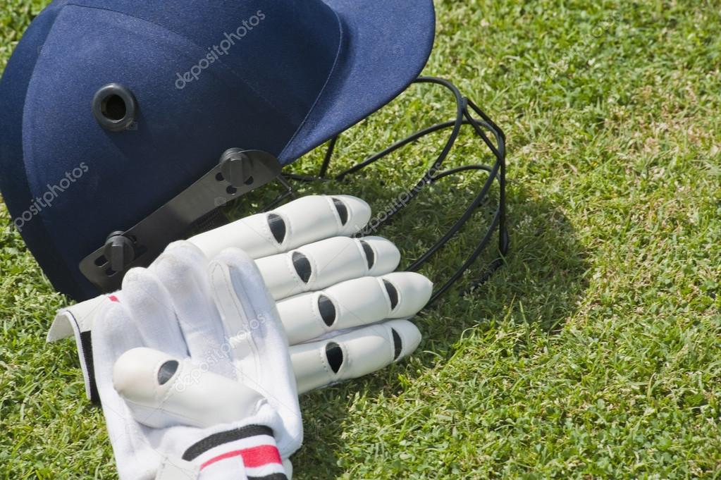 Cricket helmet and batting gloves Stock Photo by ©imagedb_seller 33034155