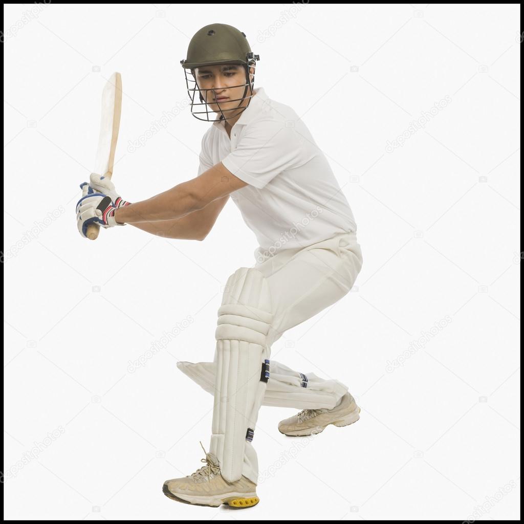 Cricket batsman playing a straight drive