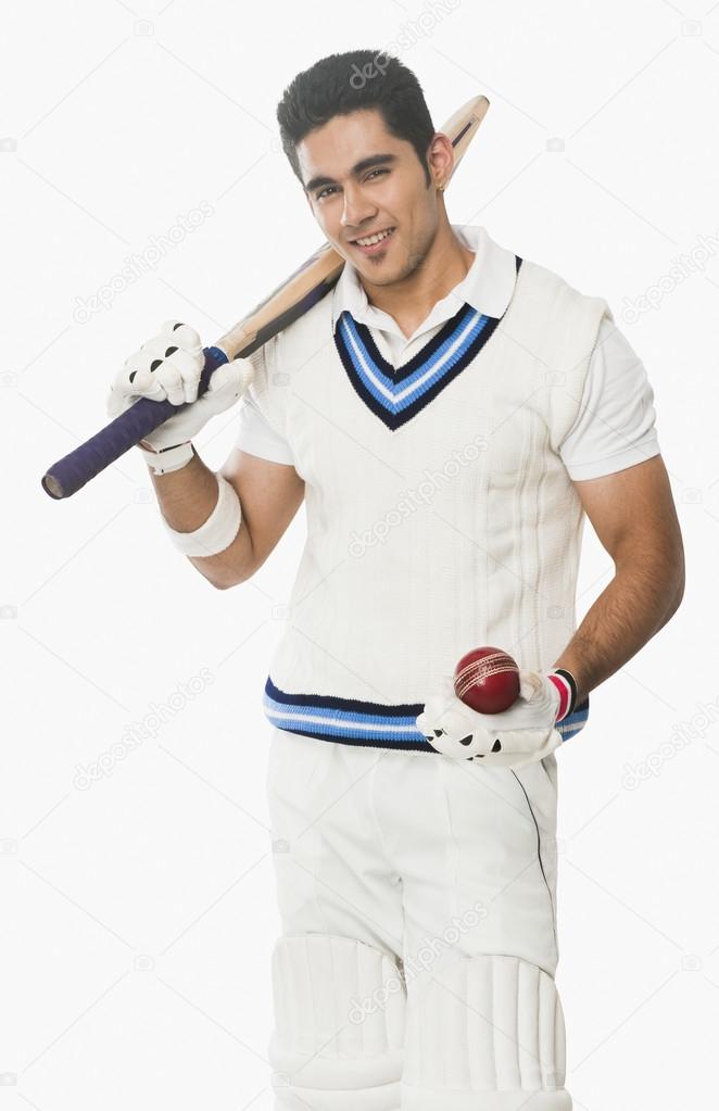 Cricket batsman holding a bat and a ball — Stock Photo © imagedb_seller