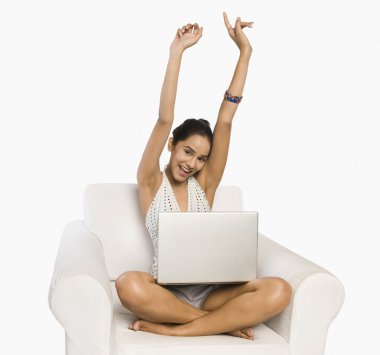 Woman using a laptop clipart