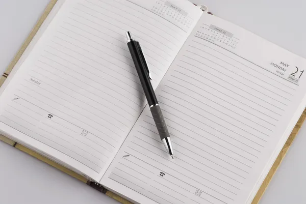 Pen on a personal organizer — Stock Photo, Image