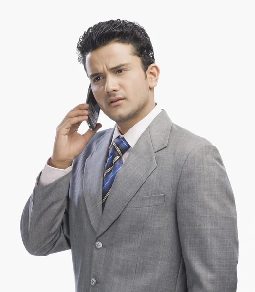 Empresário falando em um telefone celular — Fotografia de Stock