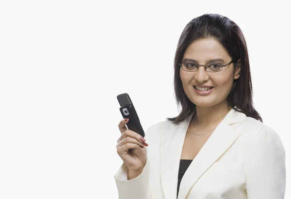 Businesswoman holding a mobile phone — Stock Photo, Image