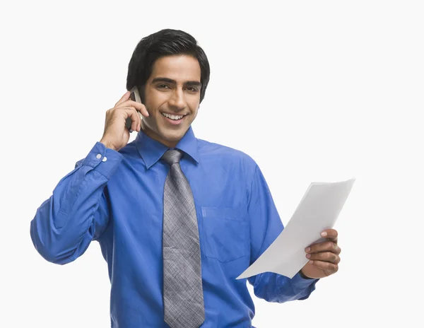 Businessman holding a document — Stock Photo, Image