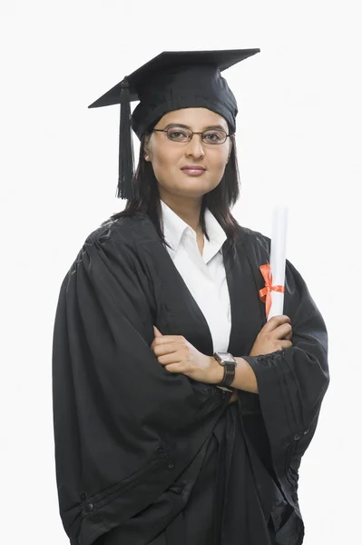 Woman holding a diploma in graduation gown — Stock Photo, Image