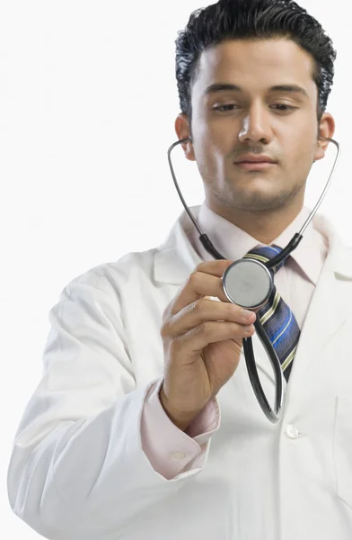 Doctor examining with a stethoscope Royalty Free Stock Photos