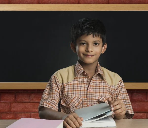 Boy imitating a teacher in a classroom — Stock Photo, Image