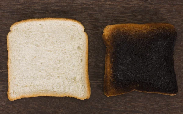 Slice of a bread with a burnt toast — Stock Photo, Image