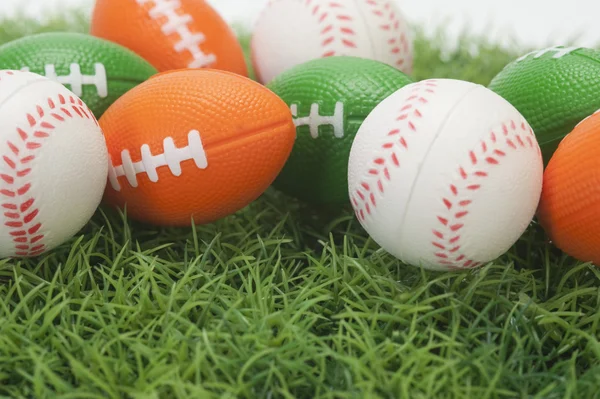 Assorted balls on grass — Stock Photo, Image