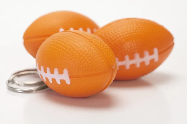 American football shaped key rings — Stock Photo, Image