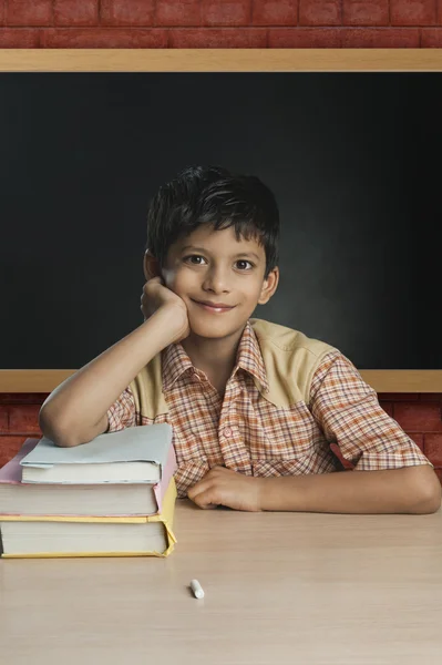 Boy imitating a teacher in a classroom — Stock Photo, Image