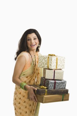 Woman holding Diwali presents clipart